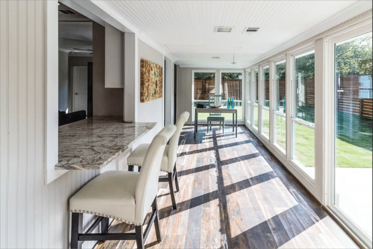 Bright sunroom with counter and chairs