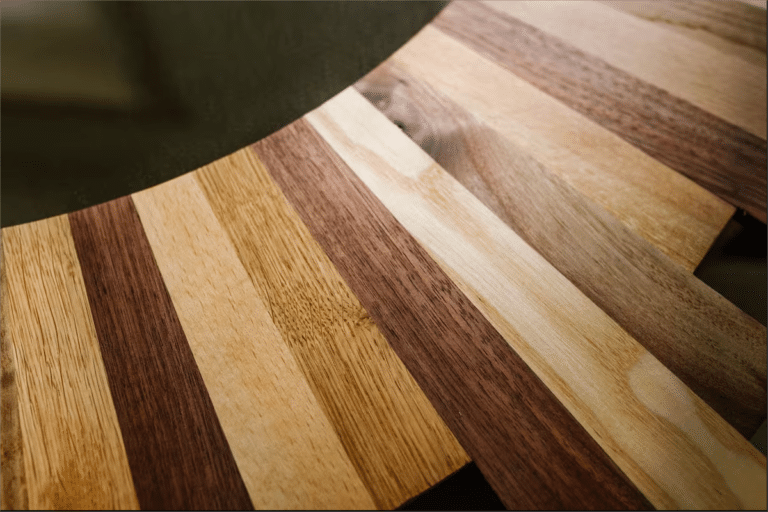 Curved wooden planks in light and dark tones.