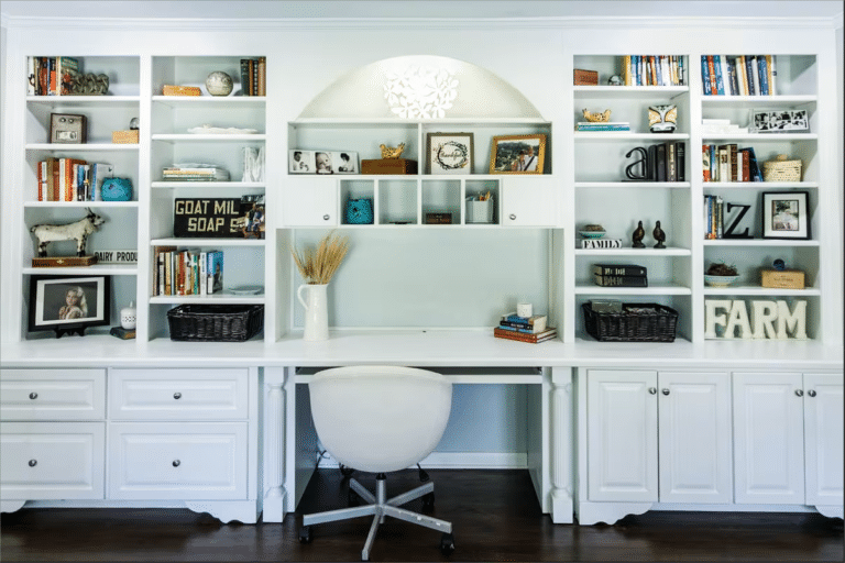 White home office with bookshelves and chair